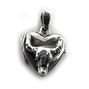 May include: A silver heart-shaped locket with a bull skull design. The locket has a hinged opening and a loop for attaching a chain.