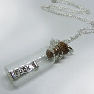 Tiny real glass bottle pendant with a handmade mini small tiny silver scroll with curled ends with the word FUCK engraved on both sides, inside the bottle that moves freely, cork top attached to an 18" chain 'My last fuck given' 'dont give a fuck'