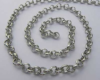 May include: A silver chain necklace with a delicate, round link design. The chain is coiled and laid out on a white surface.