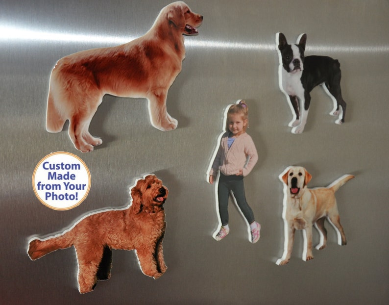 May include: Five custom-made refrigerator magnets featuring images of dogs and a child. The magnets are made from photos and have a white border. The text "Custom Made from Your Photo!" is on a blue circle.
