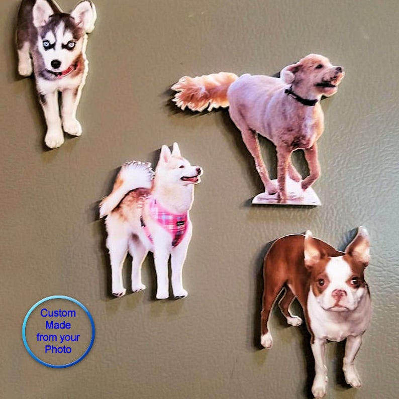 May include: Four custom-made dog magnets, each featuring a different breed. The magnets are made from photos and are printed on a white background. The text "Custom Made from your Photo" is visible in the bottom left corner of the image.
