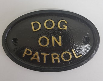 Dog On Patrol house/garden wall plaque black with gold raised lettering
