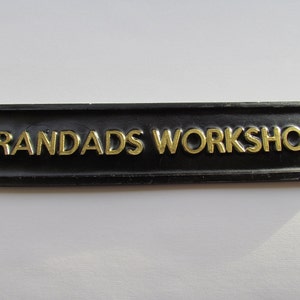 Grandad's Workshop Shed Wall Plaque With Raised Gold Lettering Made From Solid Weatherproof Resin 7.5" x 1.5"