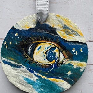 Moon eye wood ornament