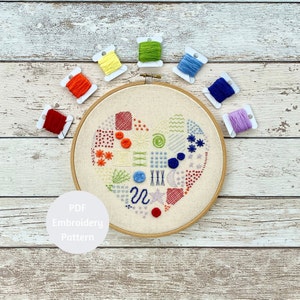 Peut inclure: Un modèle de broderie PDF pour un motif de cœur coloré. Le motif comprend une variété de points et de couleurs, notamment le rouge, l'orange, le jaune, le vert, le bleu et le violet. Le motif est parfait pour les débutants et les brodeurs expérimentés.