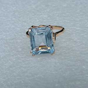 Sale-Man made blue Aquamarine and gold ring-Emerald cut Aquamarine in 10 carat yellow gold