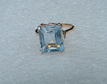 Sale-Man made blue Aquamarine and gold ring-Emerald cut Aquamarine in 10 carat yellow gold