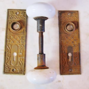 Two Antique White Porcelain Door Knobs with Back Plates