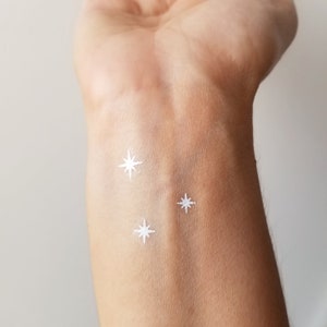 Small star tattoo -  Schweiz