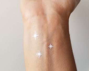 small stars or sparkles white temporary tattoo