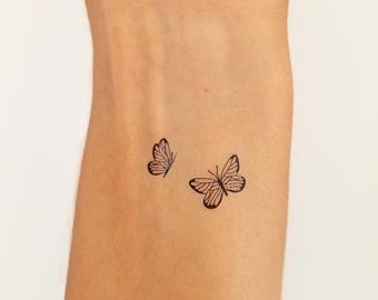 tijdelijke tatoeage kleine zwarte vlinders