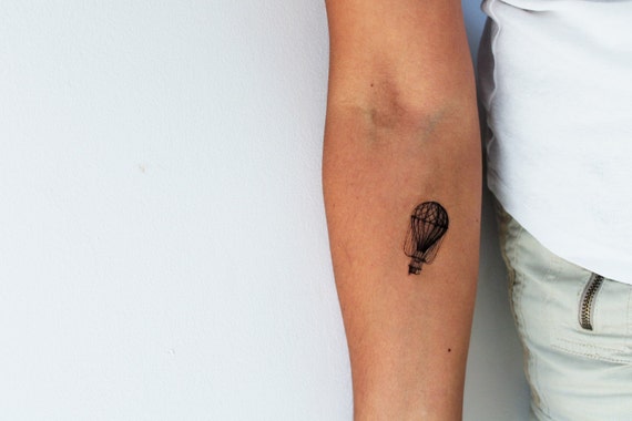 Hot air balloon tattoo on the inner arm