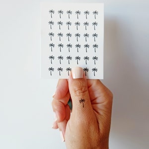 May include: A set of three ceramic mugs with a speckled, matte finish. The mugs are in shades of cream, light brown, and dark brown. Each mug has a simple, minimalist design, perfect for coffee or tea.