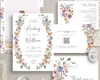 May include: A collection of wedding stationery featuring floral designs. The invitation includes the names "Audrey and William", date, and location. Other cards include RSVP, details, and thank you notes. The design incorporates watercolor flowers and a photo.