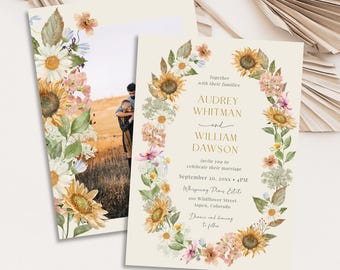 May include: Wedding invitation with a floral wreath design featuring sunflowers, daisies, and other flowers. The invitation includes the names Audrey Whitman and William Dawson, along with event details. The background is a soft cream color.