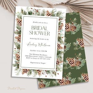 May include: Bridal shower invitation with a watercolor design. The invitation features text within a white frame, surrounded by pinecones and greenery. The back of the invitation has a green background with a repeating pinecone and greenery pattern.