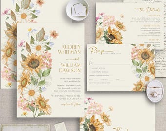 May include: Wedding invitation suite featuring watercolor sunflowers, daisies, and other floral elements. The invitation includes details for Audrey Whitman and William Dawson's wedding, with RSVP and thank you cards. The suite has a rustic, elegant design.