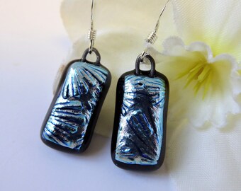Silver/black dichroic glass earrings. Fused glass silver flower earrings. Silver fused glass earrings with textured floral pattern.