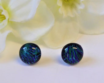 Fused glass stud earrings with a deep green floral pattern. Emerald green dichroic glass studs. Green glass flower earrings. Floral earrings