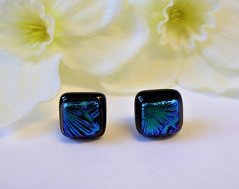 Emerald green and black dichroic glass stud earrings. Fused glass earrings with green flower pattern. Fused glass green/black stud earrings.