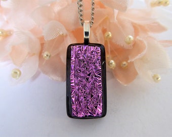 Pink/black dichroic glass pendant with a textured pattern. Pink-black fused glass necklace. Pretty pink glass pendant with crinkle texture.