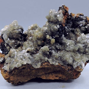Calcite on hydrohetaerolite from Spain – miniature