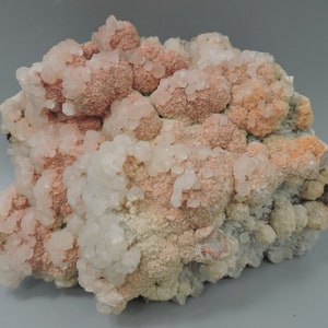 Rhodochrosite with calcite and needle quartz from Kosovo – fluorescent - large cabinet size