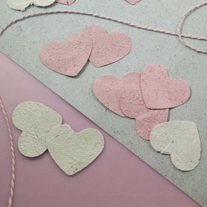 20 plantable paper hearts made from handmade recycled paper containing wildflower seeds perfect for eco friendly zero waste wedding favours