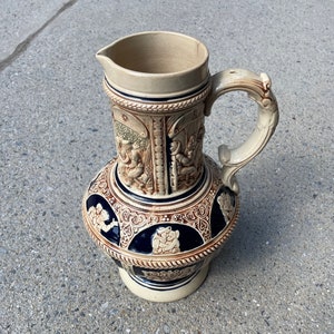 Vintage pottery, handcrafted sculpture centerpiece, imported German carafe with intricate Craft work