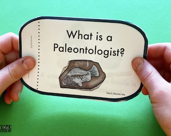 May include: A card with the text "What is a Paleontologist?" and an illustration of a fossilized fish. The card is held by two hands against a green background. The text "Teach Beside Me" is at the bottom.
