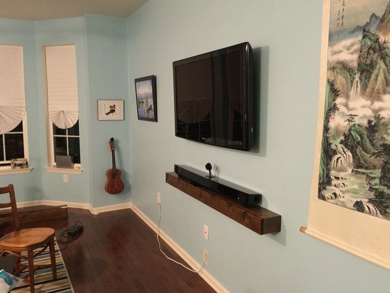 Rustic floating wood shelves with hidden fasteners, TV entertainment center