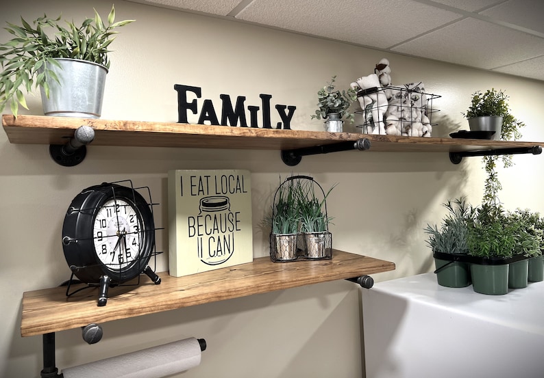Rustic farmhouse pipe mounted wood shelves from an angle, with a paper towel holder (a custom option)