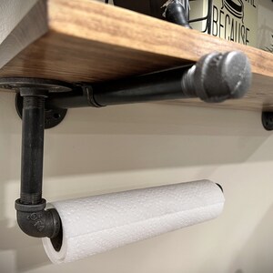 Pipe bracket under the shelf, with a paper towel holder (a custom option)