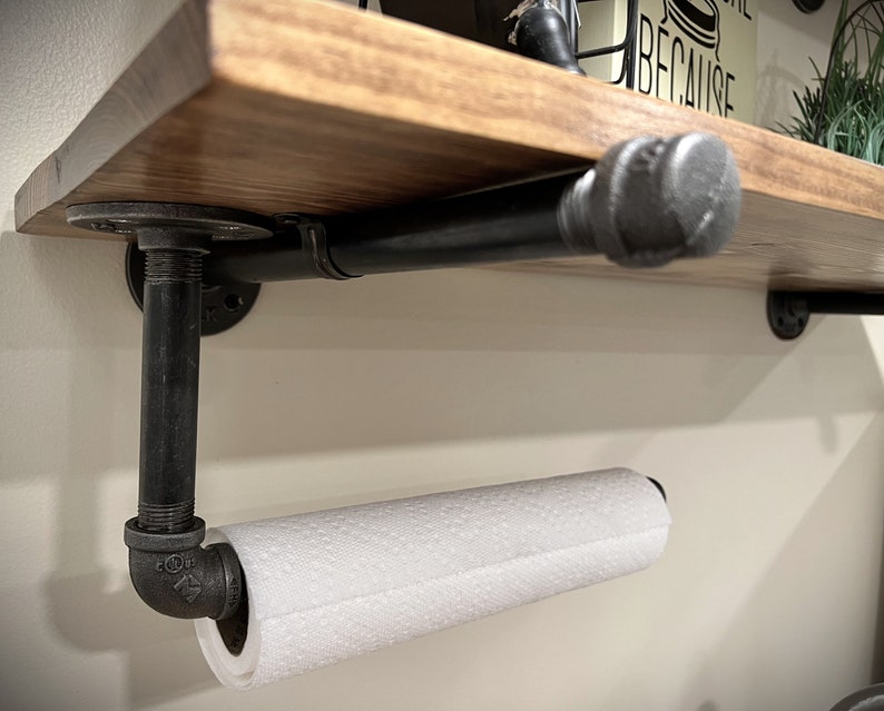 Pipe bracket under the shelf, with a paper towel holder (a custom option)