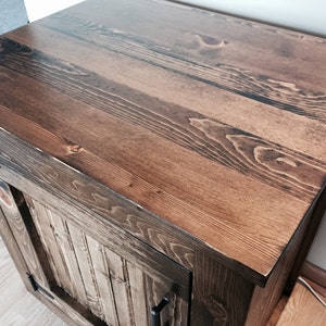 Close-up of the solid pine planked vanity top in a dark walnut stain