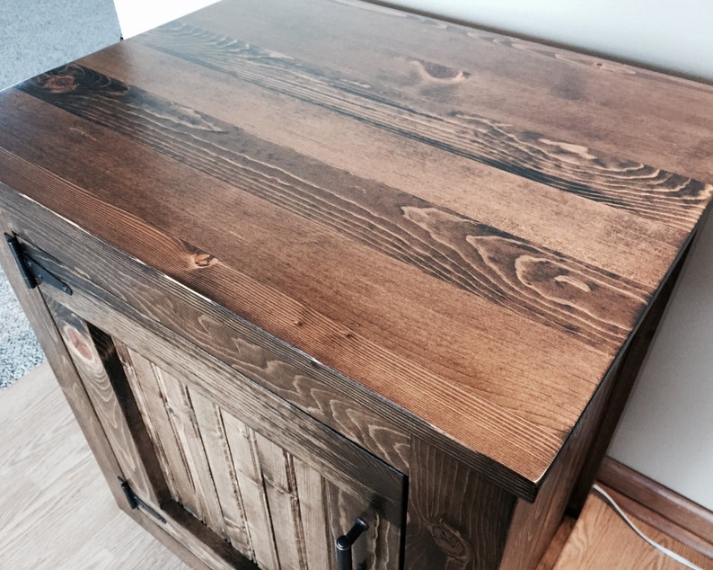 Close-up of the solid pine planked vanity top in a dark walnut stain