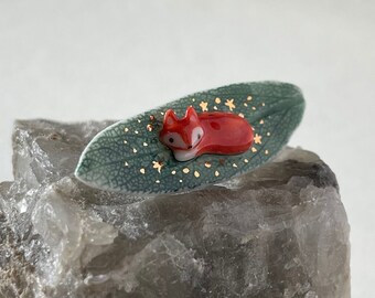 Porcelain fox on sage leaf pin decorated with gold