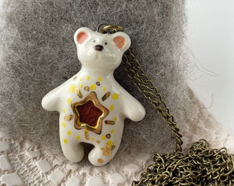 Ceramic polar bear essential oil diffuser pendant with gold details and star