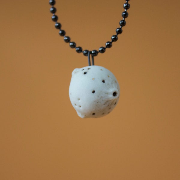 Porcelain miniature Full Moon pendant decorated with 22k gold