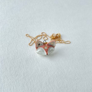 Porcelain miniature fox with opal pendant decorated with 22k gold image 4