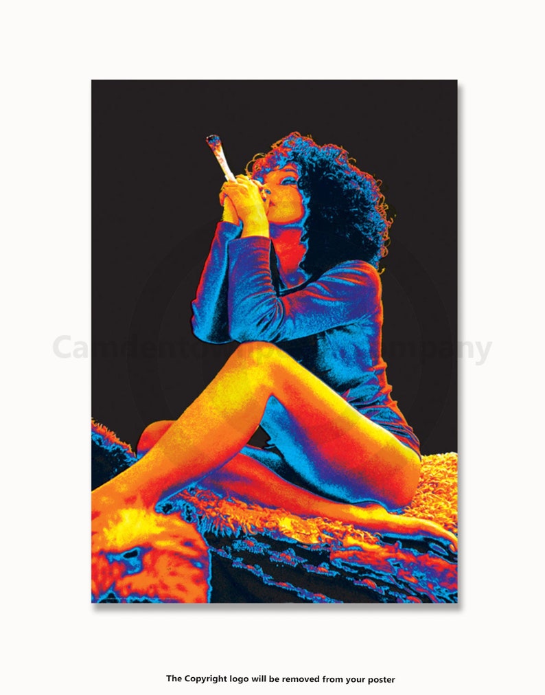 May include: A woman with dark hair sits on a rug, wearing a blue shirt and holding a lit joint in her hand. The image is in a thermal colour scheme, with reds, oranges, and blues.