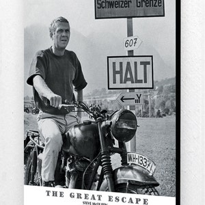 May include: Black and white poster featuring Steve McQueen on a motorcycle. The image includes signs with German text, including "ACHTUNG" and "Schweizer Grenze." The poster also displays the film title "THE GREAT ESCAPE."