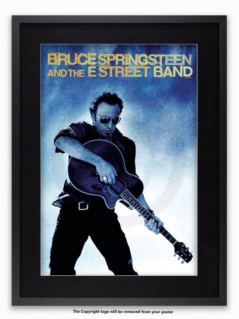 May include: A black and white poster featuring Bruce Springsteen and the E Street Band. The poster has a blue background with a white cloud-like design. Springsteen is playing a guitar and looking at the camera.