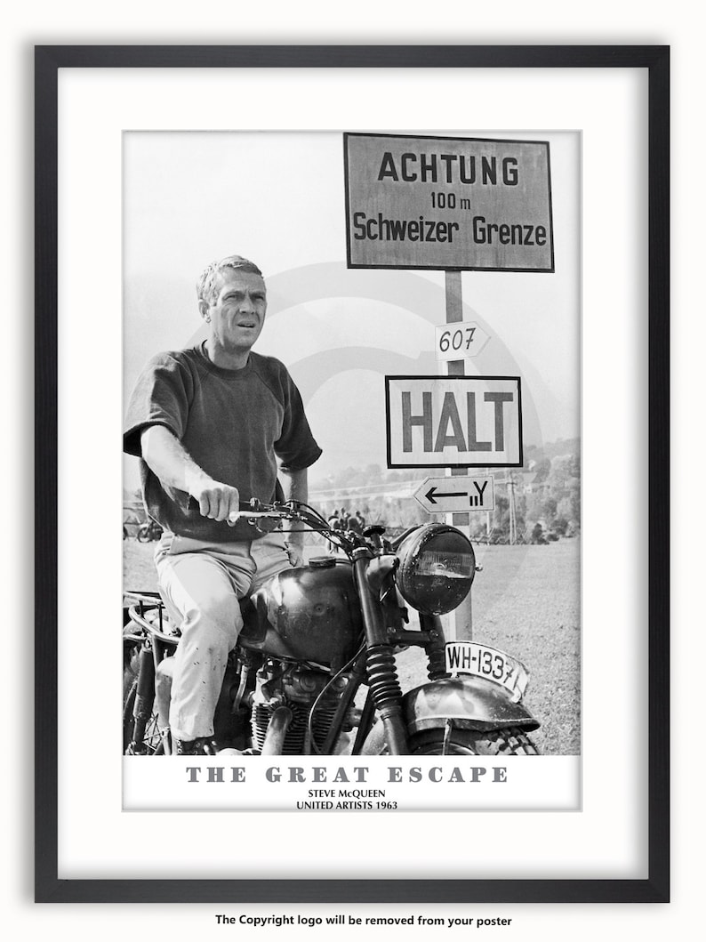 May include: Black and white framed poster featuring Steve McQueen on a motorcycle. The poster includes the text "THE GREAT ESCAPE" and "UNITED ARTISTS 1963". Road signs in German are visible in the background, adding a vintage aesthetic.