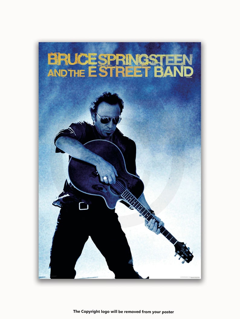 May include: A black and white poster featuring Bruce Springsteen and the E Street Band. The poster has a blue background with a faded effect. Bruce Springsteen is playing a guitar and is wearing a black shirt and jeans. The text "Bruce Springsteen and the E Street Band" is in gold lettering.