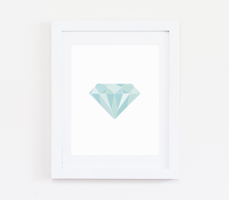 May include: A framed print of a light blue geometric diamond shape on a white background.