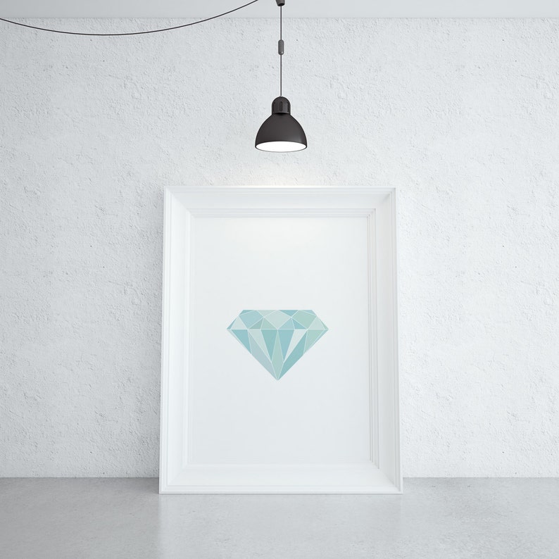 May include: A white framed picture with a light blue geometric diamond shape in the center.