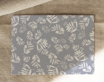 Paper placemat printed in DIN A 3 - illustrated olive branches in white on grey by Chilli & Jens