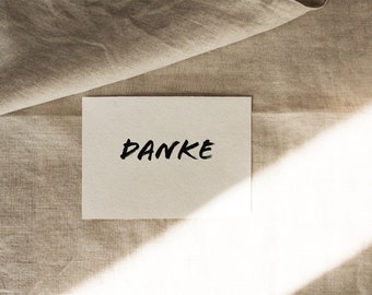 Postcard "DANKE" lettering printed black on natural cardboard white - DIN A6 by Chilli und Jens