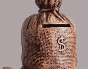 Vintage ceramic piggy bank in the shape of a bag.